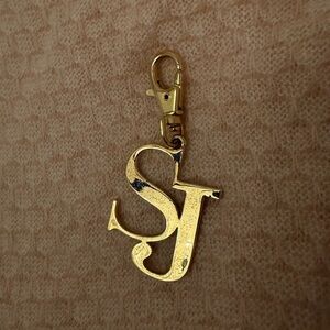 St. John SJ brand initials monogram gold tone keychain bag charm